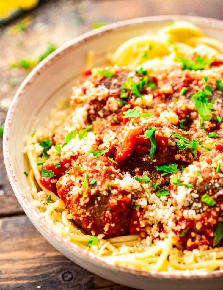 Spaghetti and meatballs in a cream bowl