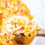 Cheesy Ham Bow Tie Pasta on wooden spoon