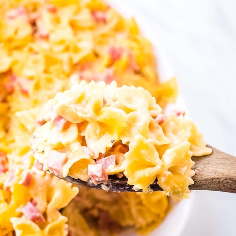Cheesy Ham Bow Tie Pasta on wooden spoon