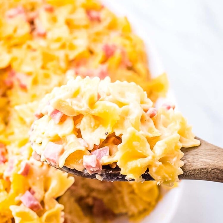 Cheesy Ham Bow Tie Pasta on wooden spoon