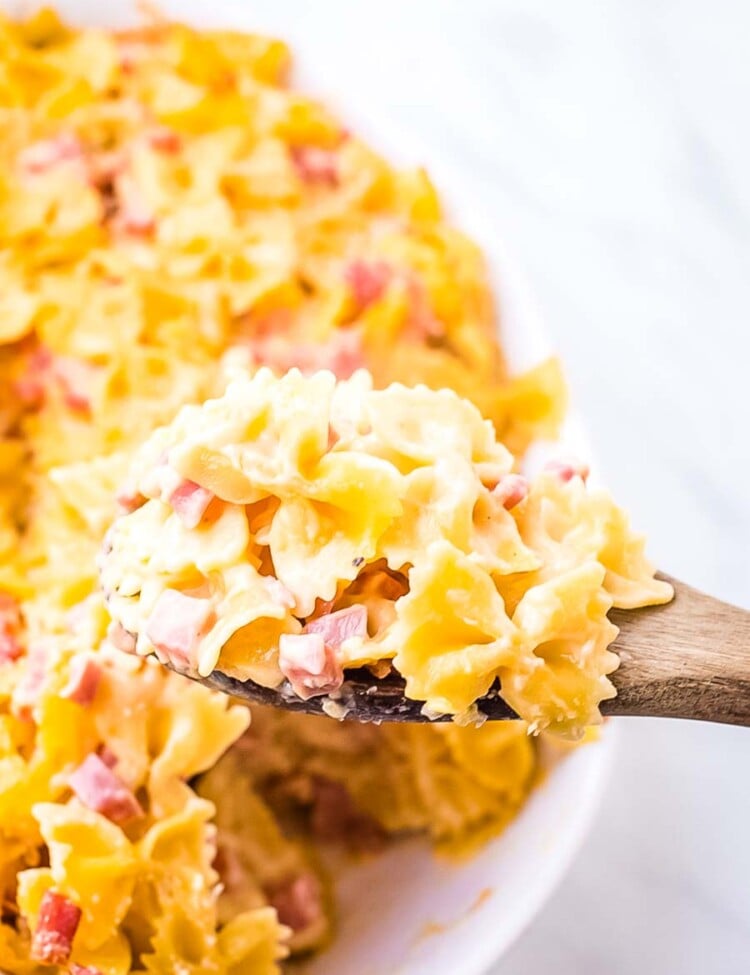 Cheesy Ham Bow Tie Pasta on wooden spoon