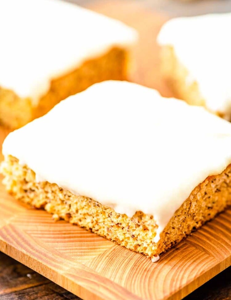 Frosted Banana Bars on cutting board