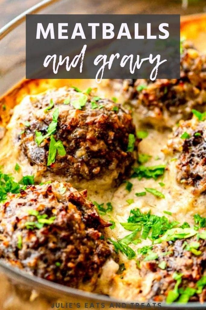 Meatballs and gravy in a glass dish garnished with parsley