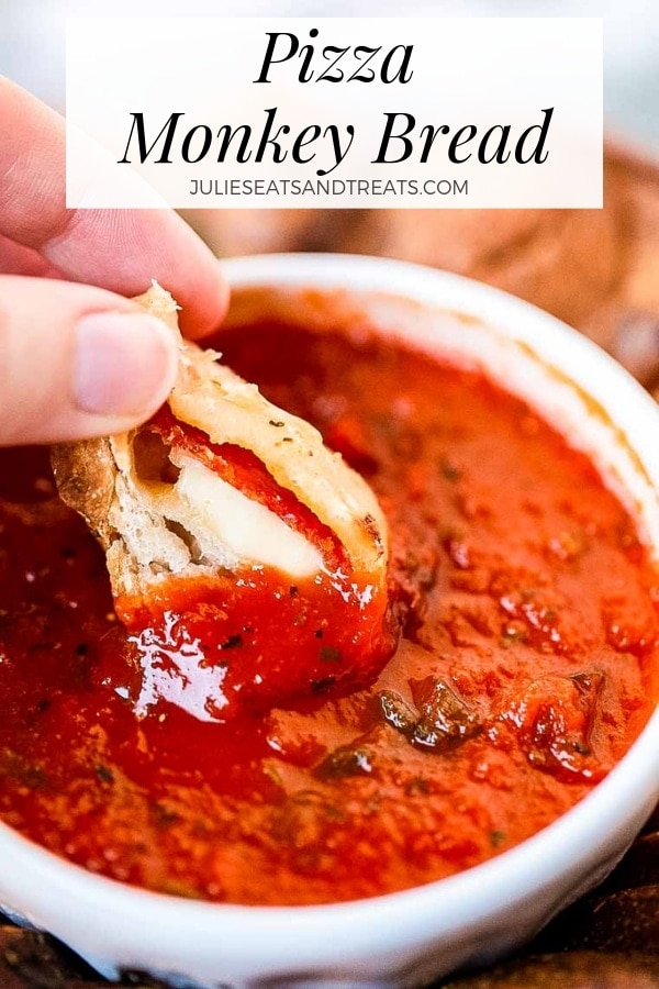 Pizza Monkey Bread being dipped into marinara sauce