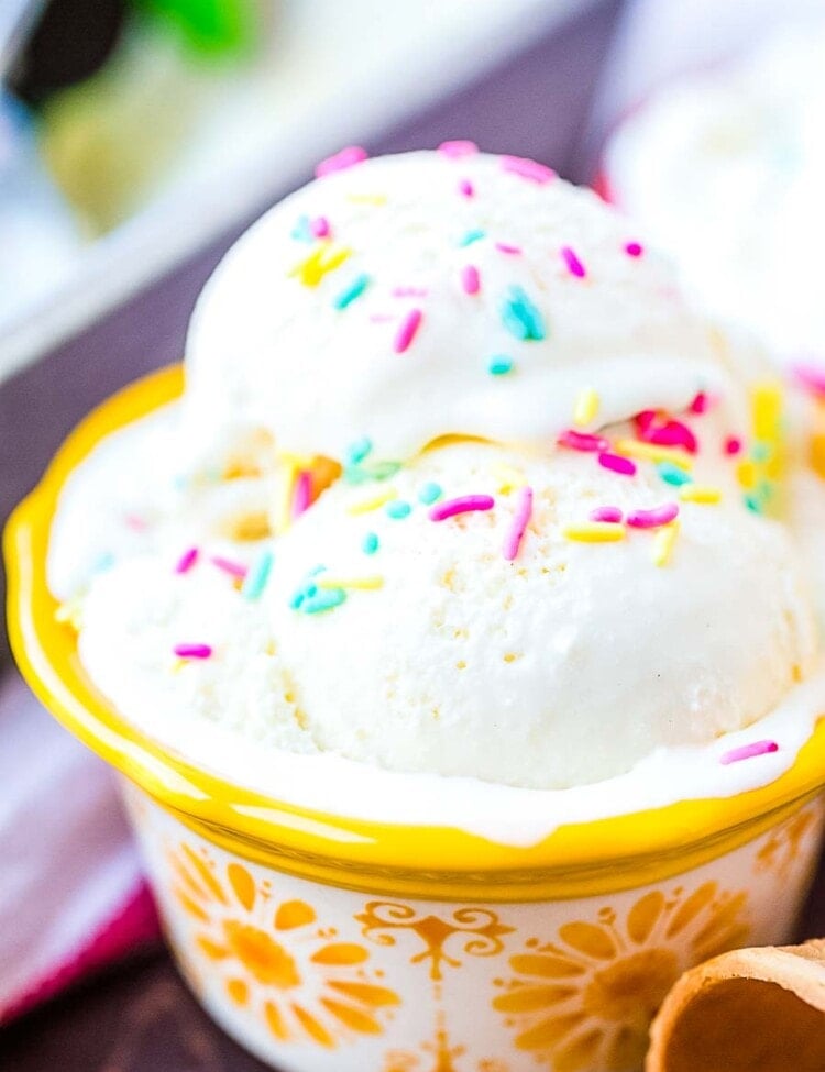 Cake Batter Ice Cream with sprinkles in yellow bowl