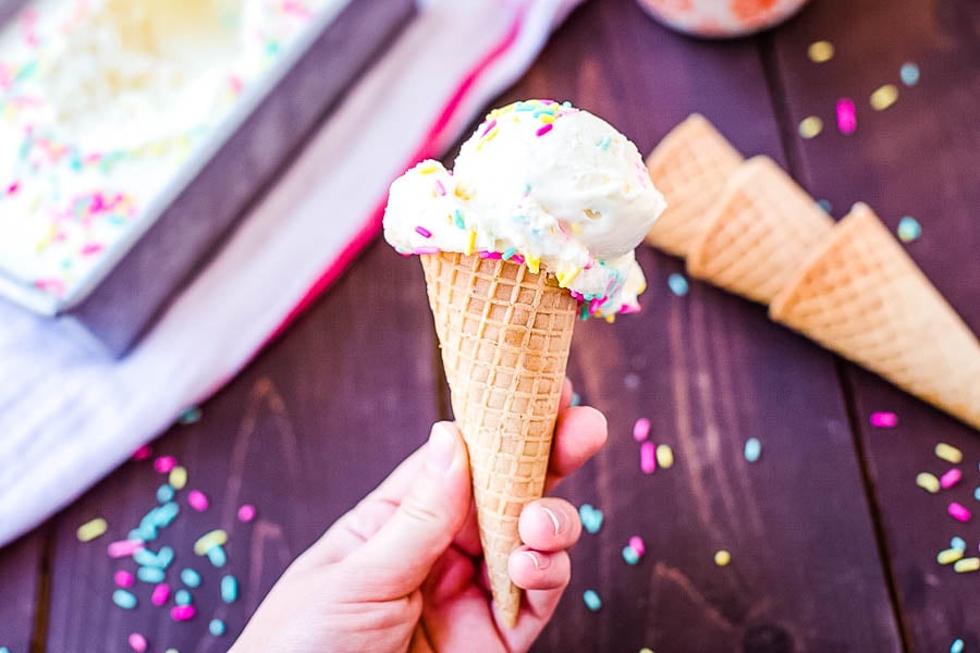 Hand holding Cake Batter Ice Cream cone