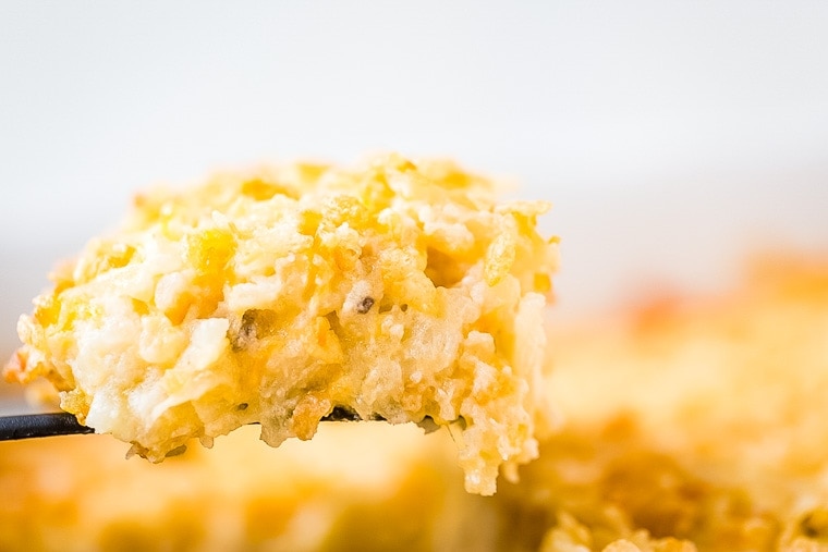 Cheesy Hash Brown Casserole on spoon.
