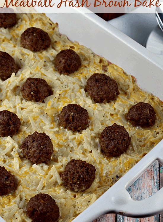 Meatball hash brown bake in a white casserole dish