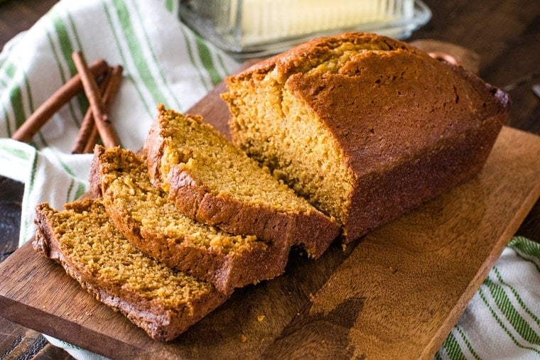 Pumpkin Bread slices on brown cutting board