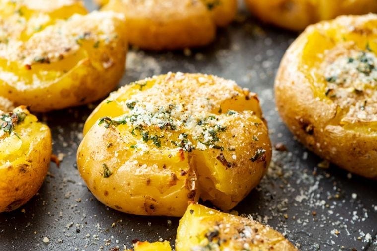 Smashed potatoes on a pan