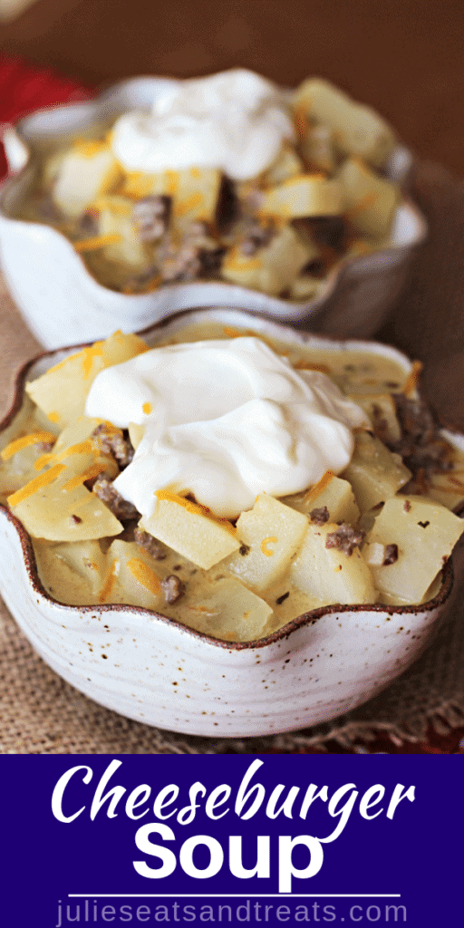 Cheeseburger soup in white bowls topped with sour cream