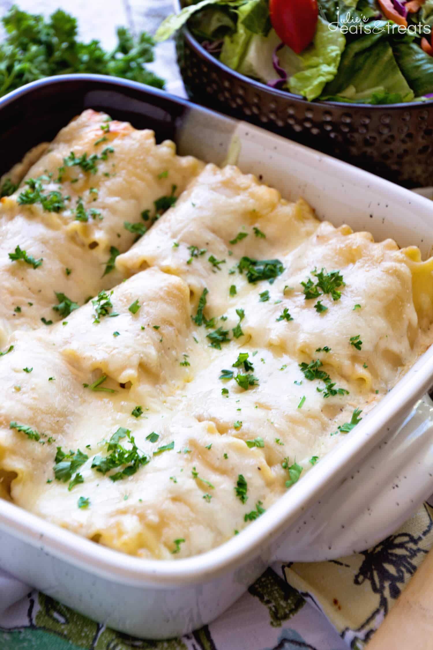 A square pan of Chicken Alfredo Roll Ups