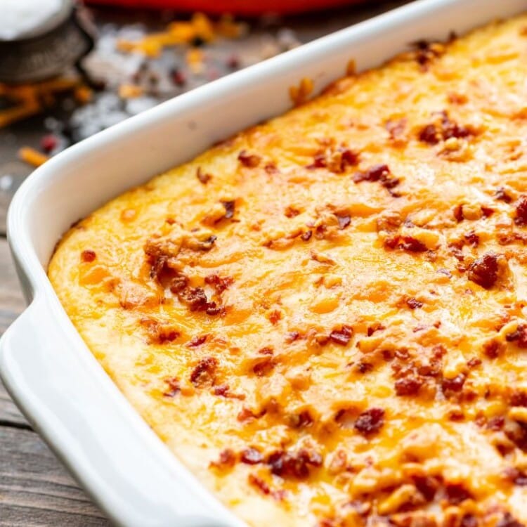 Twice baked potato casserole in a white baking dish