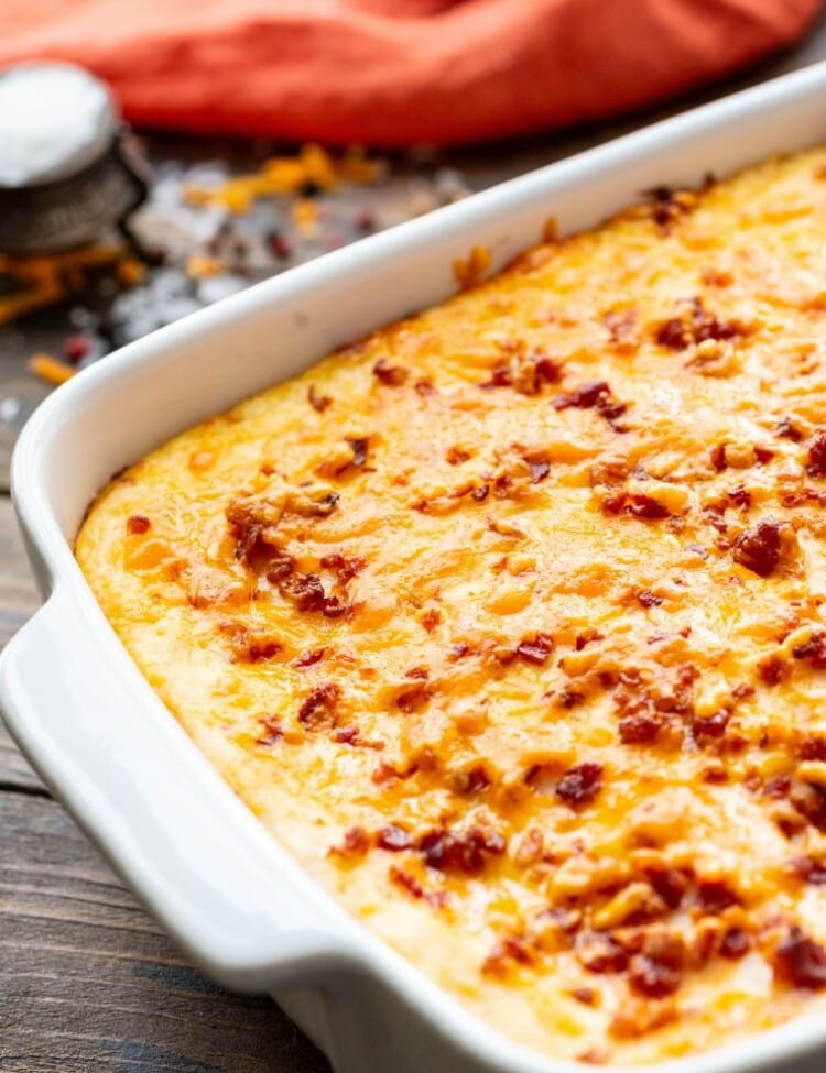 Twice baked potato casserole in a white baking dish