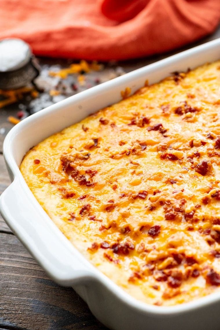 White baking dish with potato casserole in it. 