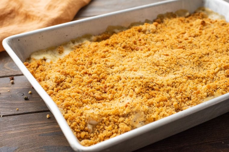 Baking dish with a chicken casserole topped with crackers