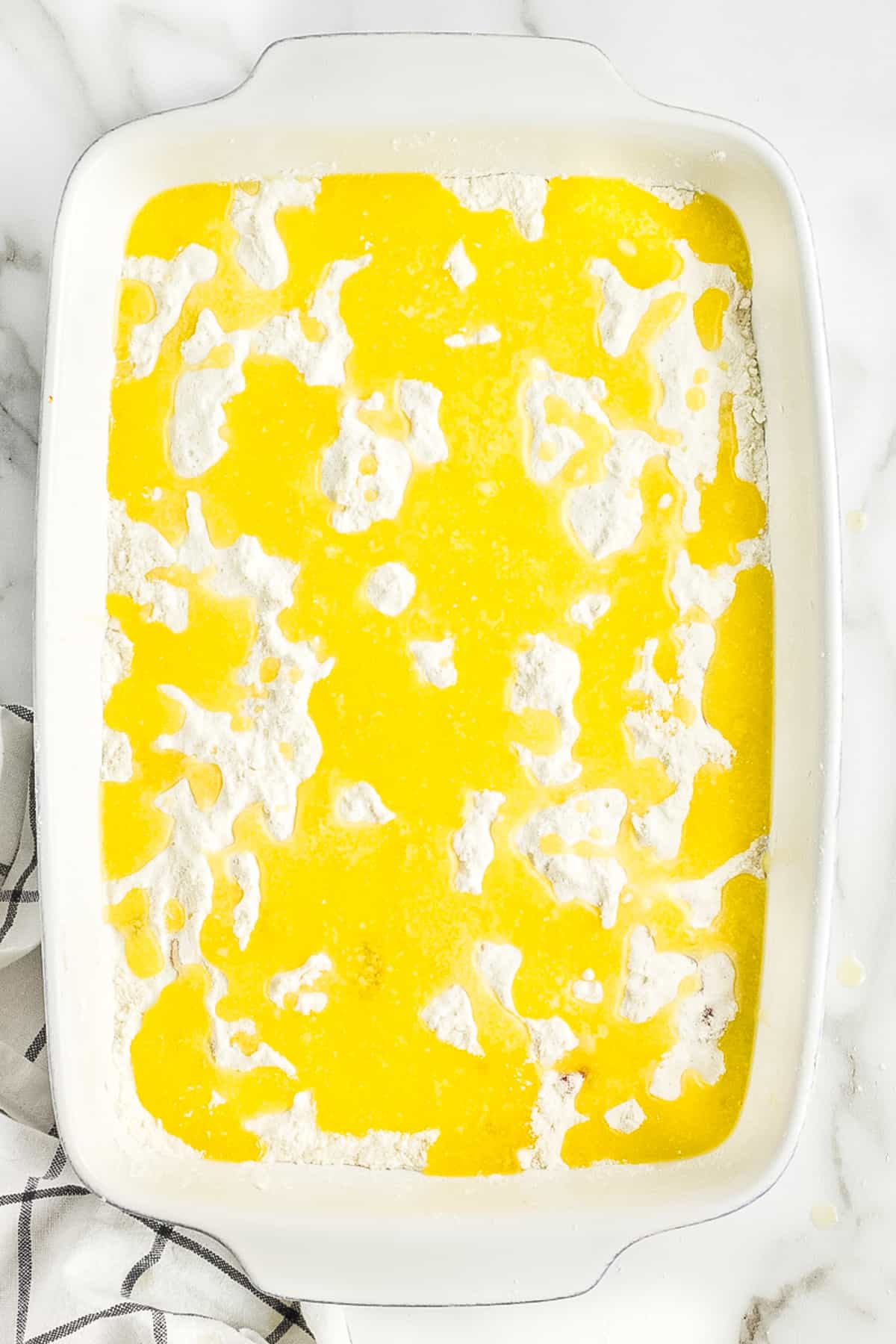 Melted butter over the top of white cake mix