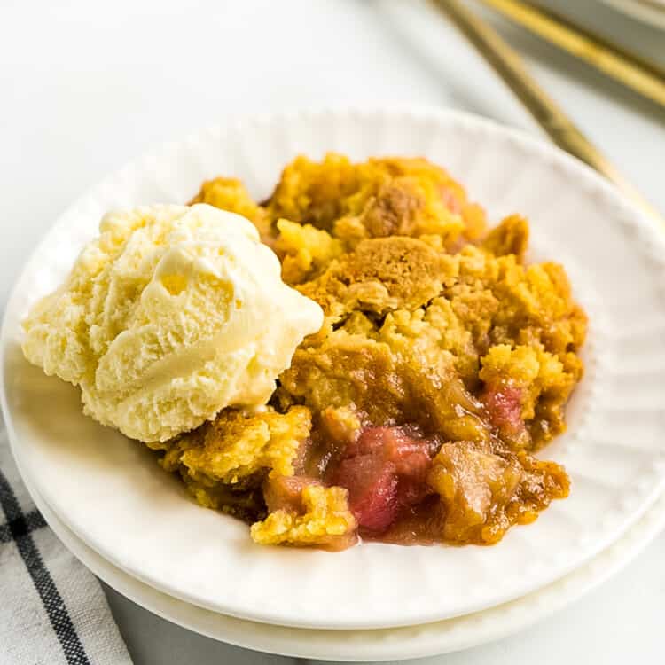 White plate with ice cream and Rhubarb Dump Cake