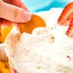 Cracker scooping Funfetti Dip from a bowl