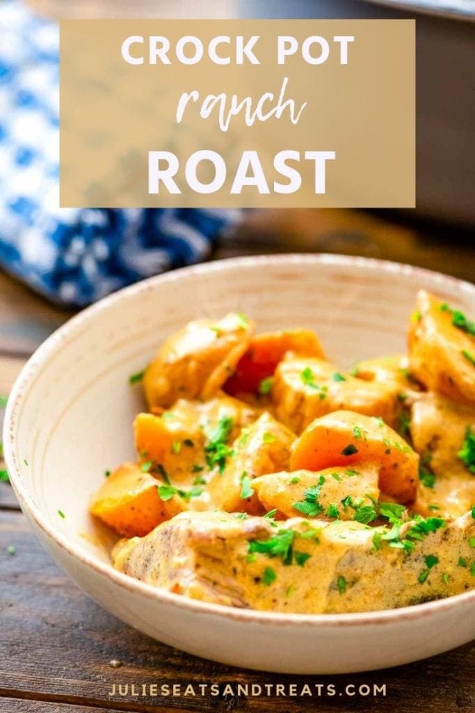 Crock pot ranch roast and potatoes in a cream bowl on a wood table