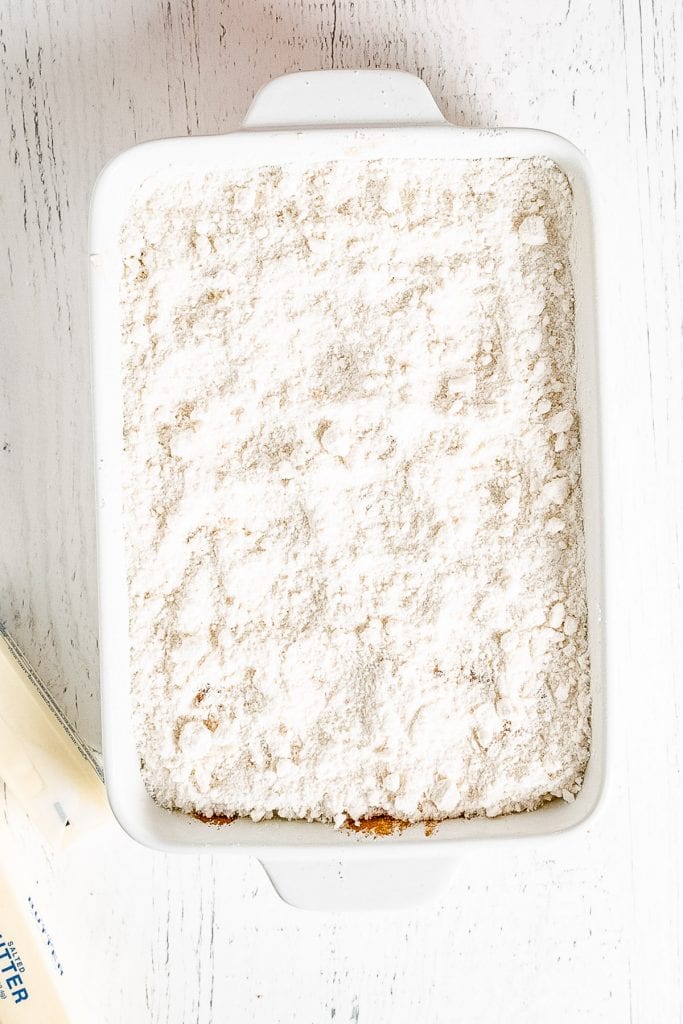 White Cake mix in white baking dish on white background