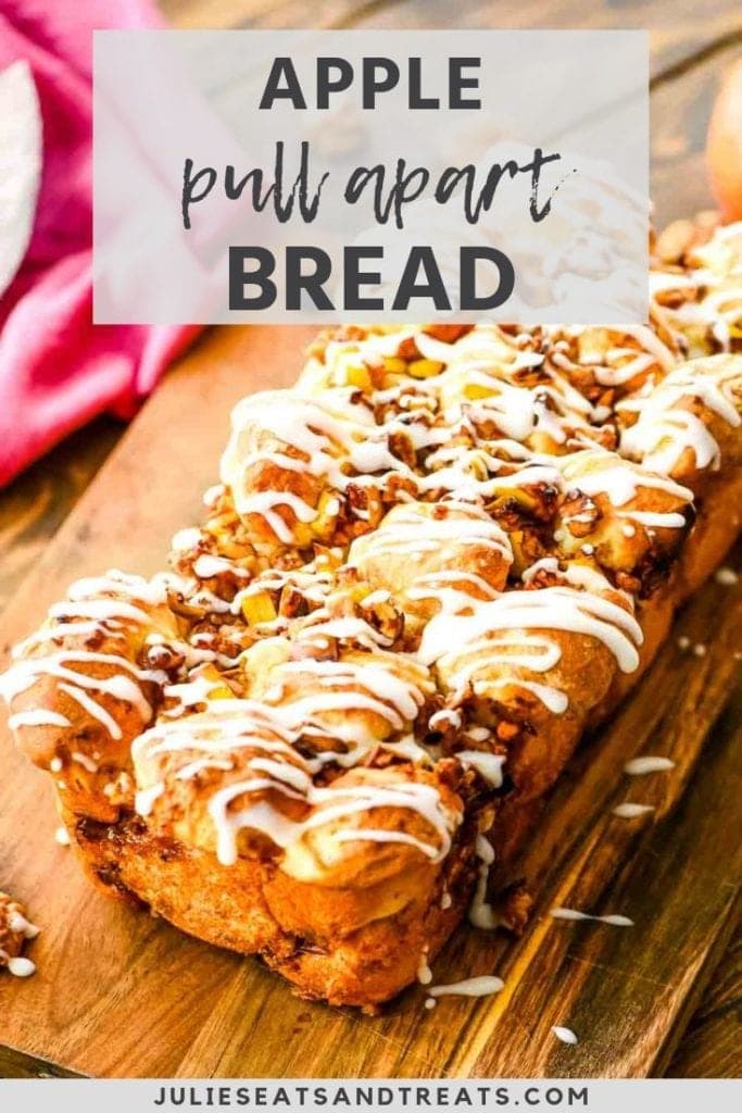 Apple pull apart bread on a cutting board drizzled with icing