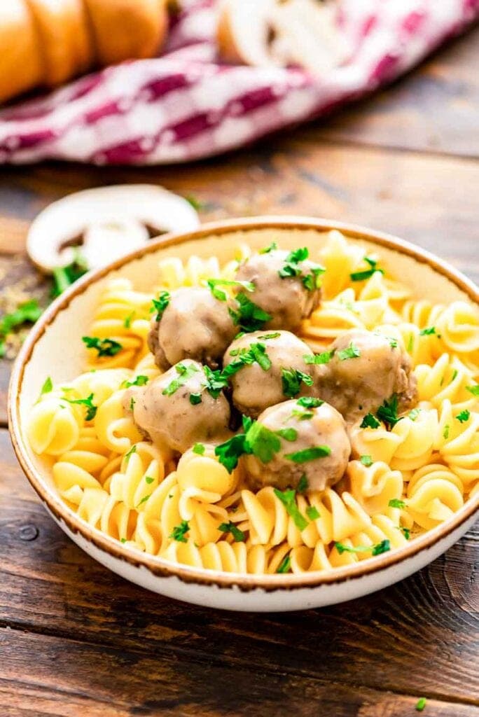 Bowl of Crockpot Swedish Meatballs and egg noodles