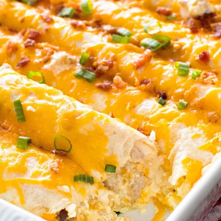 Overhead image of Overnight Breakfast Enchiladas in a white baking dish