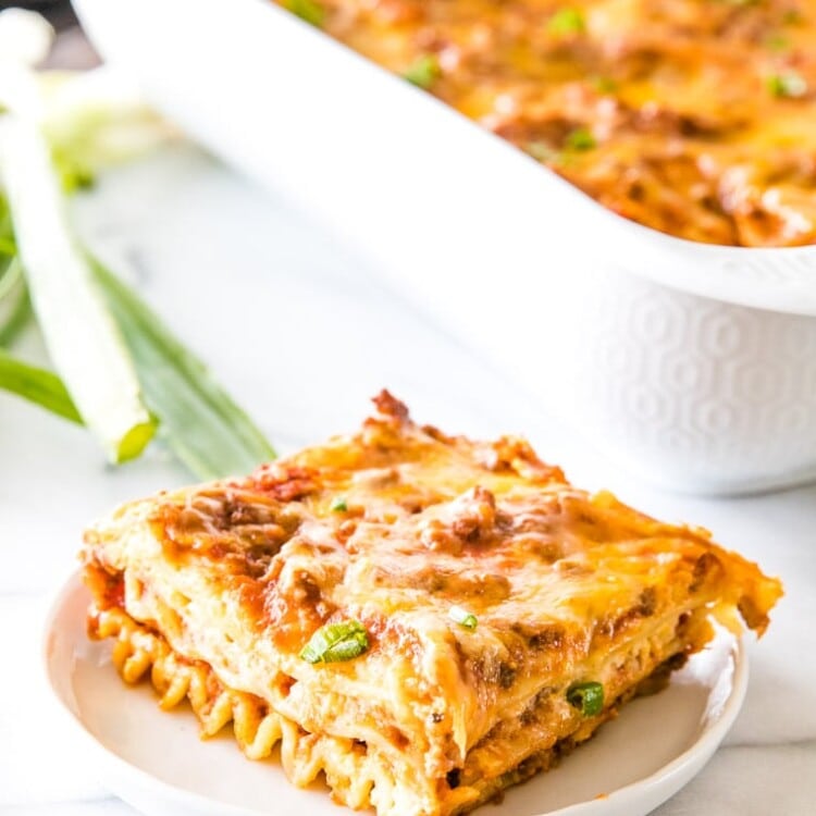 Piece of Mexican Lasagna on white plate