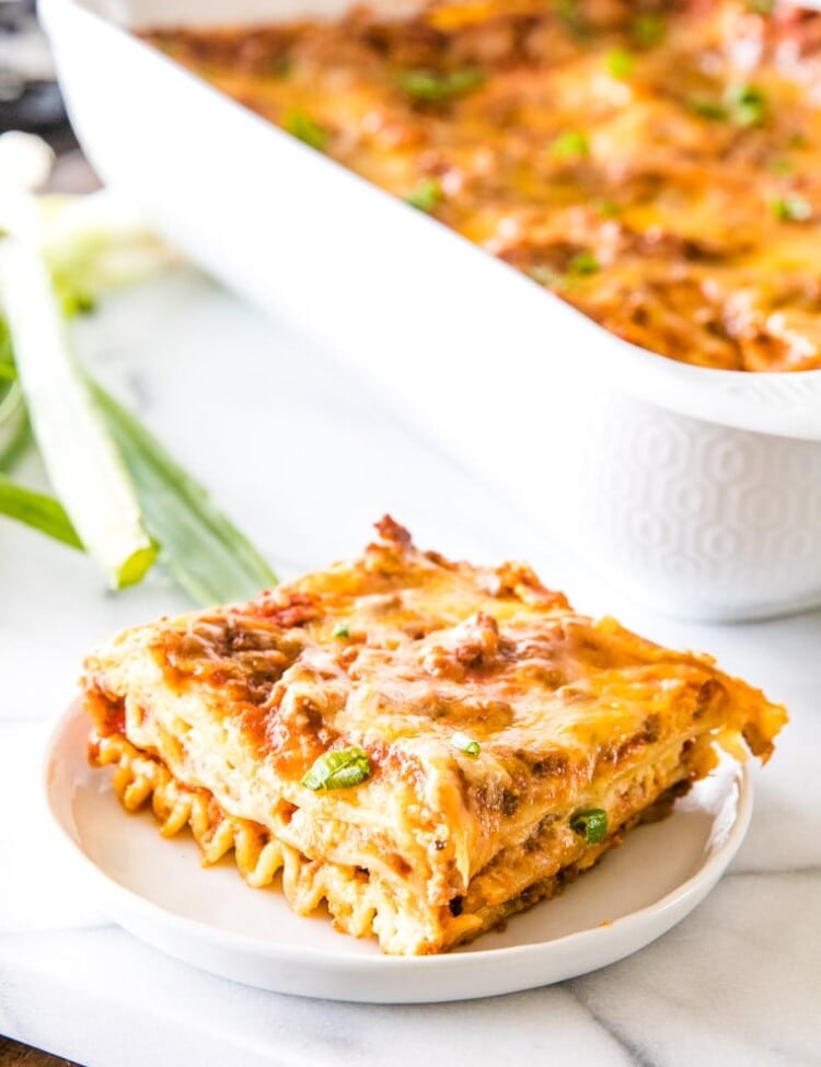 Piece of Mexican Lasagna on white plate