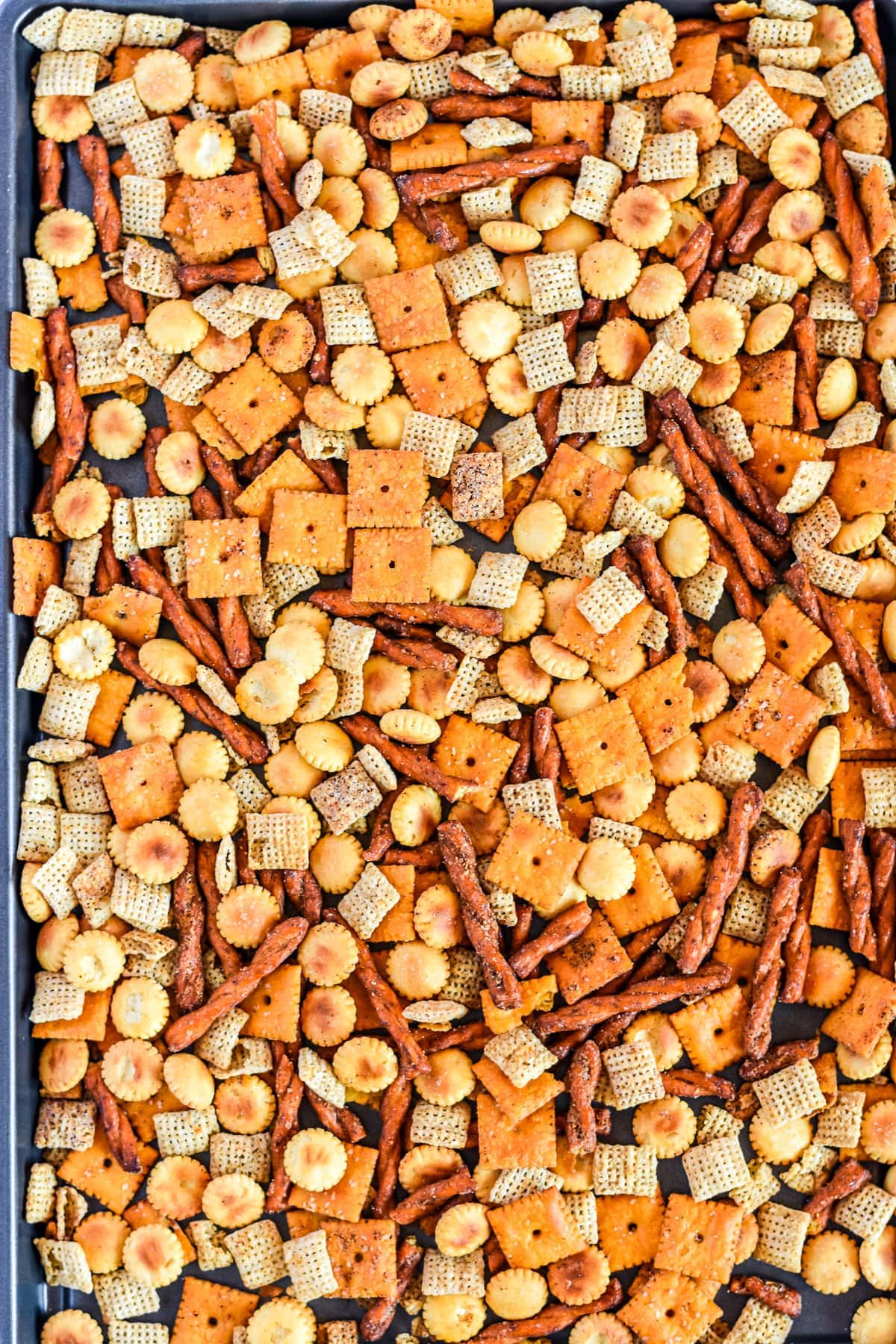Sheet pan with chex mix on it