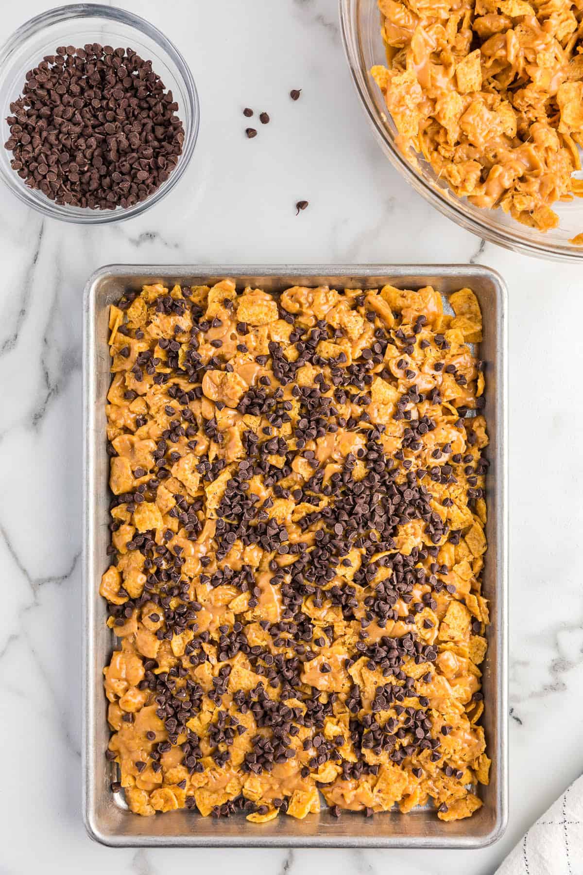 First layer of frito bars in pan topped with chocolate chips