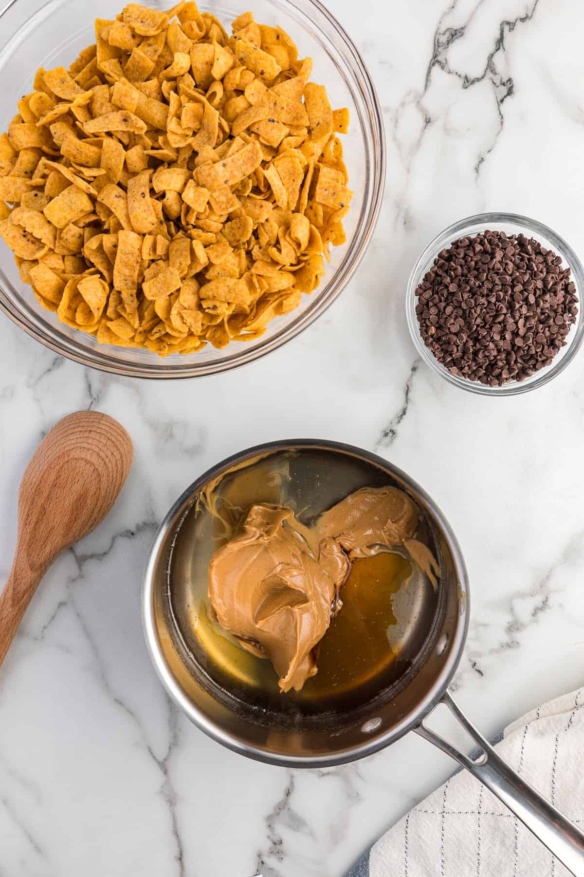 Adding peanut butter to corn syrup mixture