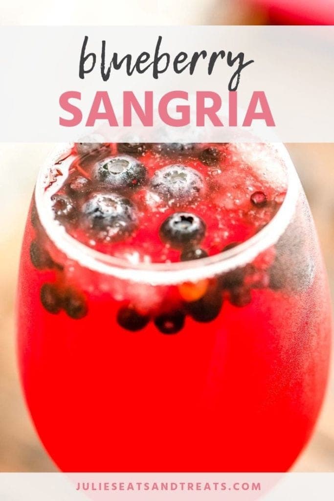 Blueberry sangria in a glass with blueberries