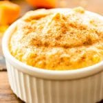 Pumpkin dip sprinkled with cinnamon in a white dish