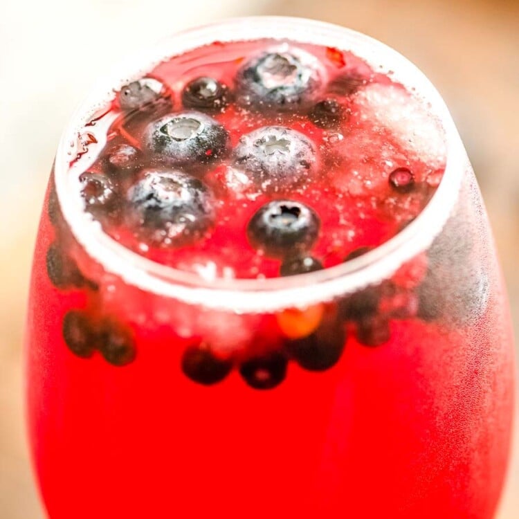 Glass of blueberry sangria with blueberries