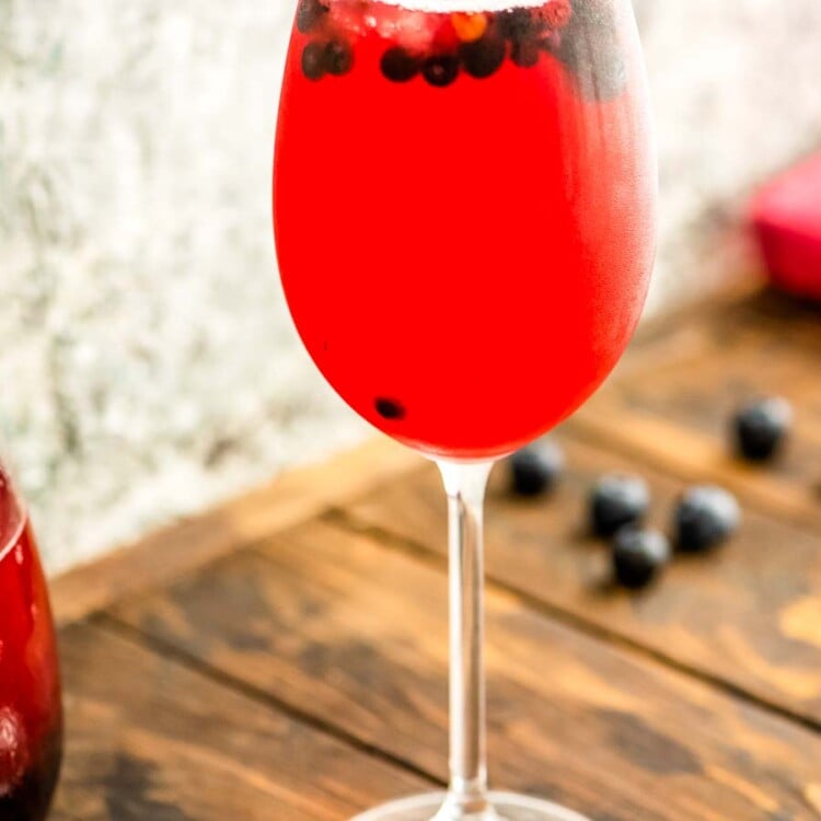 Wine Glass with blueberry sangria and blueberries
