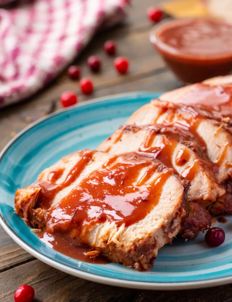 Slow Cooker Pork Loin on plate with cranberry sauce