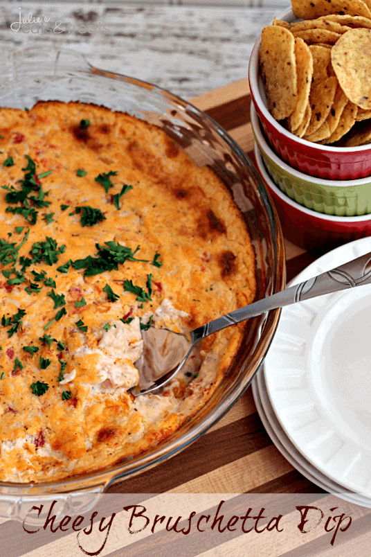 Cheesy Bruschetta Dip ~ Loaded with Cheese, Tomatoes and Garlic this dip is to die for and a must make!