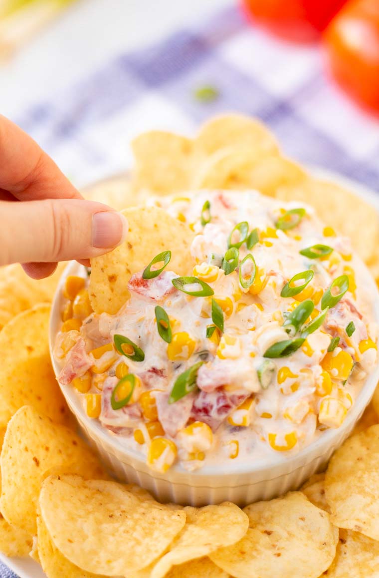 Cheesy Corn Dip in bowl with chips