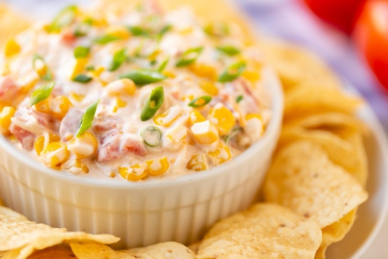 Corn Dip in white bowl surrounded by chips