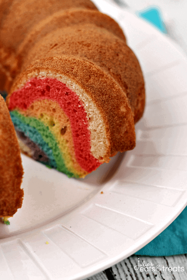 Rainbow Cloud Cake ~ Festive cake that starts with a box mix and end ups as a Rainbow Cake with Sweet & Fluffy Whipped Cream Clouds!