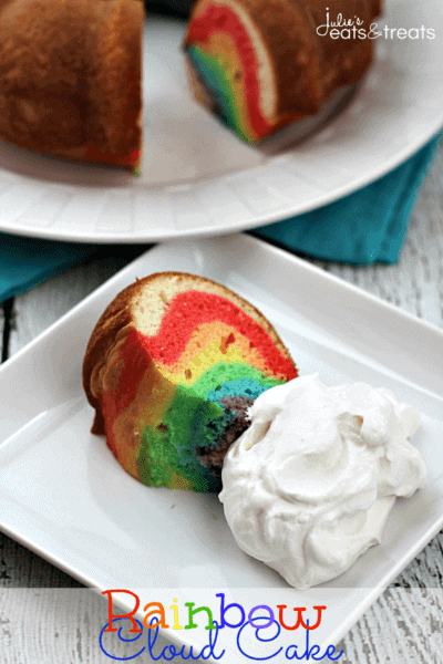 Rainbow Cloud Cake ~ Festive cake that starts with a box mix and end ups as a Rainbow Cake with Sweet & Fluffy Whipped Cream Clouds!