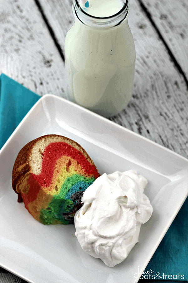 Rainbow Cloud Cake ~ Festive cake that starts with a box mix and end ups as a Rainbow Cake with Sweet & Fluffy Whipped Cream Clouds!