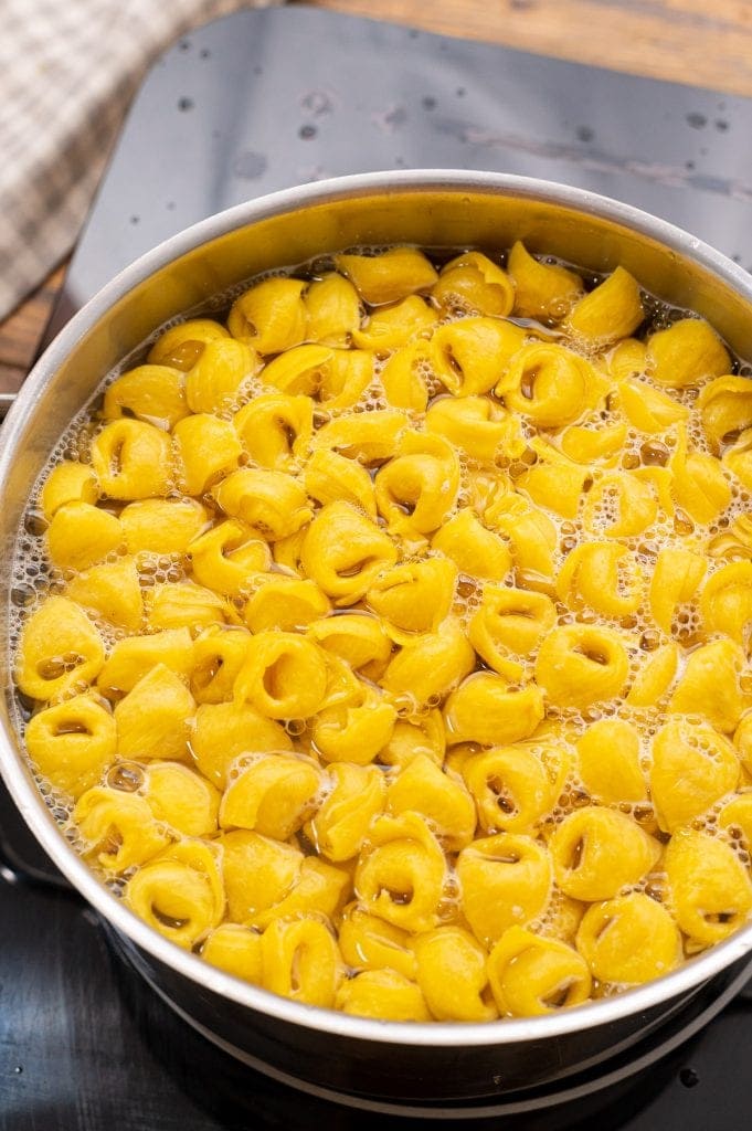 Cheese Tortellini cooking in water in a saucepan