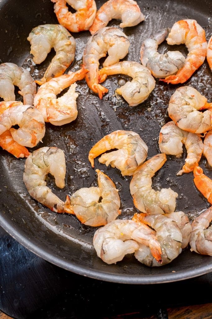 Skillet with shrimp cooking