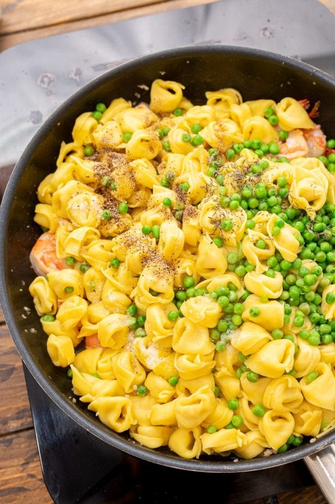 Skillet with ingredients to make Garlic Shrimp Tortellini