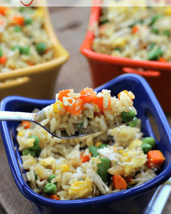 Three colorful bowls of easy chicken fried rice