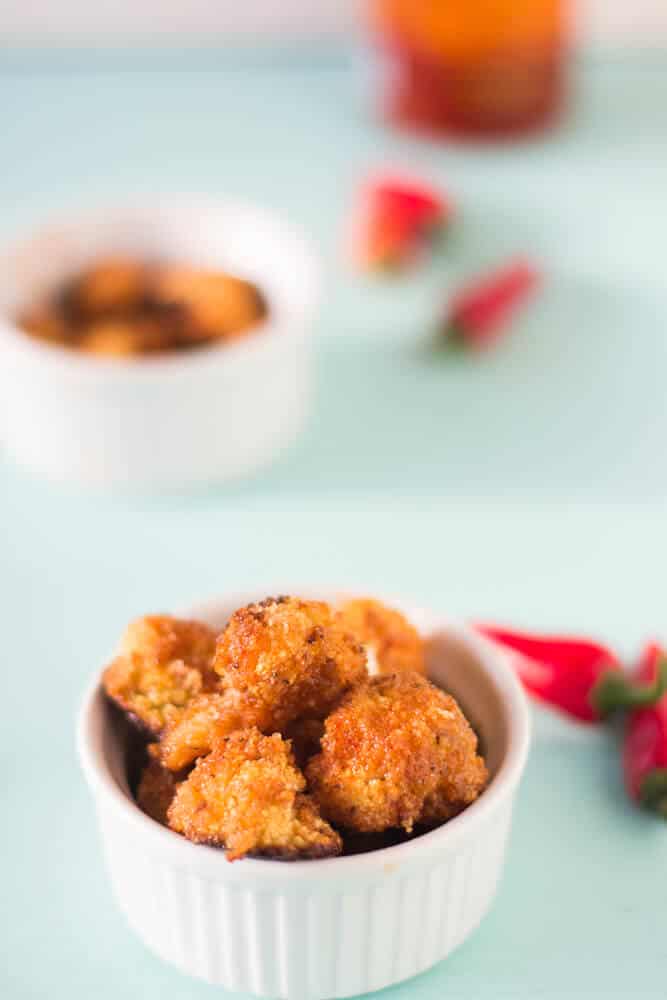 Cauliflower Bites in Honey Sriracha Sauce make a delicious and filling vegetarian meal that is a delicious balance of sweet and spicy! #vegetarian