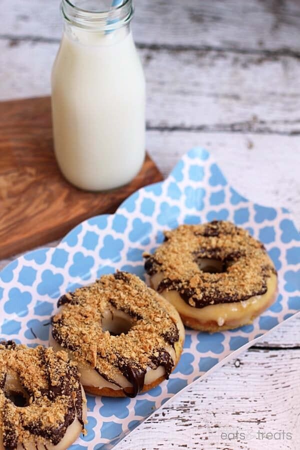 S'mores Donuts ~ Homemade Donuts Loaded with Marshmallow Frosting then Drizzled with Chocolate and Topped with Crushed Graham Crackers!